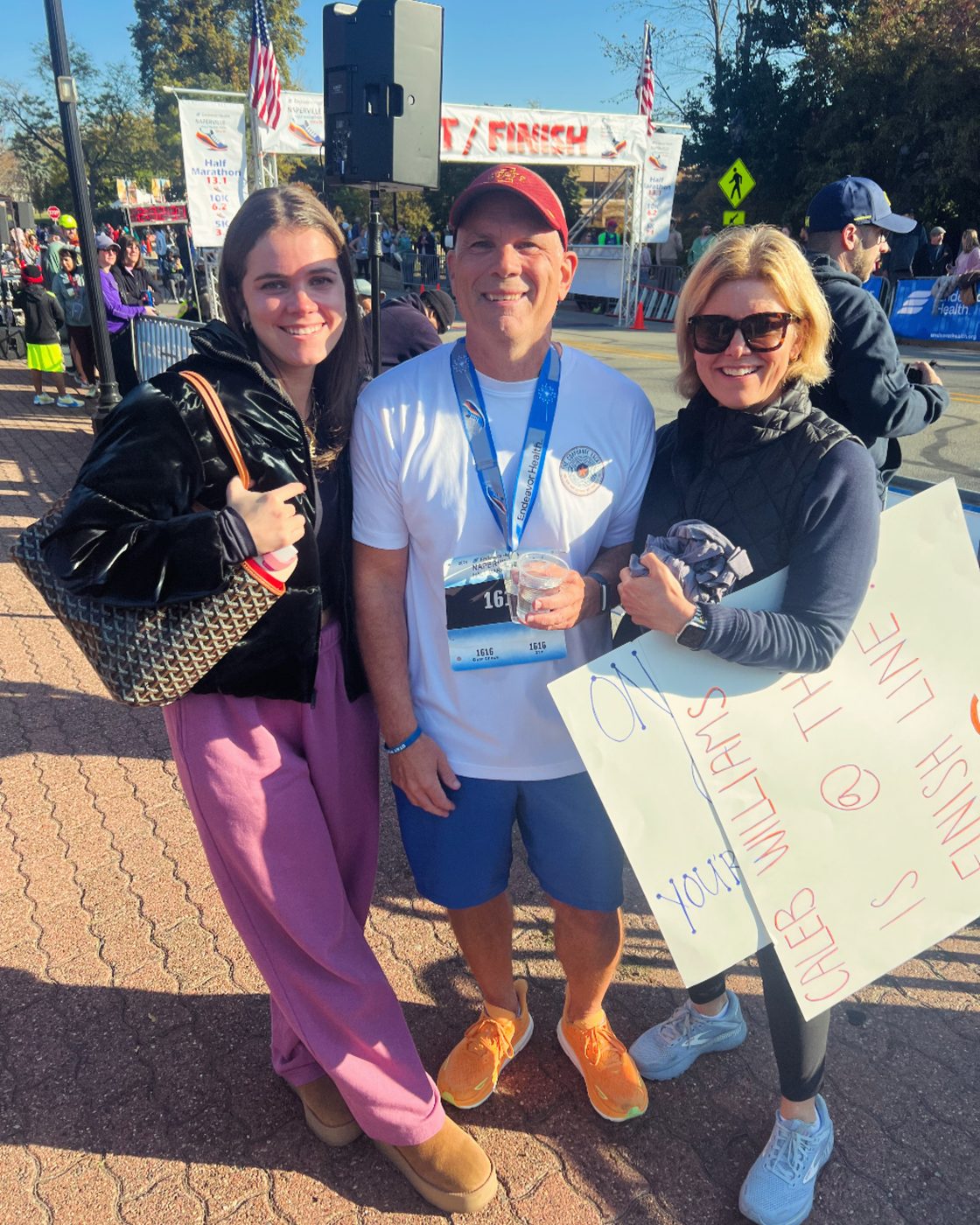 Brett with family at the half marathon finish line